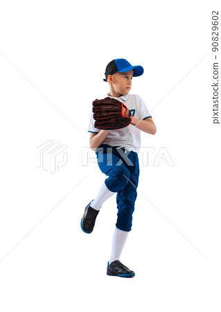 Studio shot of sportive kid, beginner baseball player in sports uniform playing baseball isolated on white background. Concept of sport, achievements, competition Studio shot of sportive kid, beginner baseball player in sports uniform playing baseball isolated on white background. Concept of sport, achievements, competition 90829602