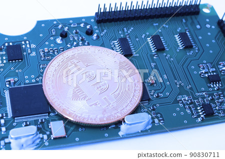 Bitcoin on the background of the motherboard 90830711