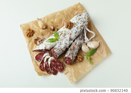 Concept of tasty food with salami sausage on white background 90832140