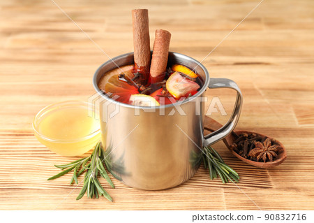Concept of cooking mulled wine on wooden background Concept of cooking mulled wine on wooden background 90832716