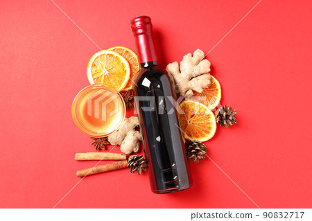 Ingredients for cooking mulled wine on red background Ingredients for cooking mulled wine on red background 90832717