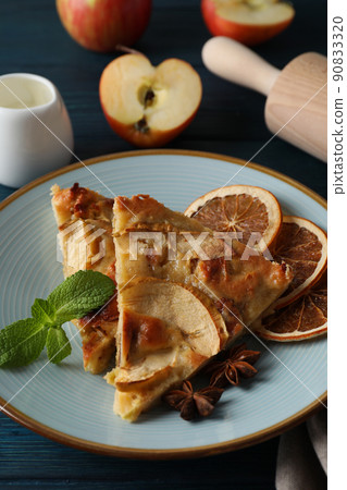 Concept of tasty food with apple pie on wooden background 90833320