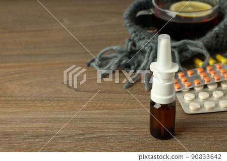 Flu treatment accessories on wooden background, space for text Flu treatment accessories on wooden background, space for text 90833642