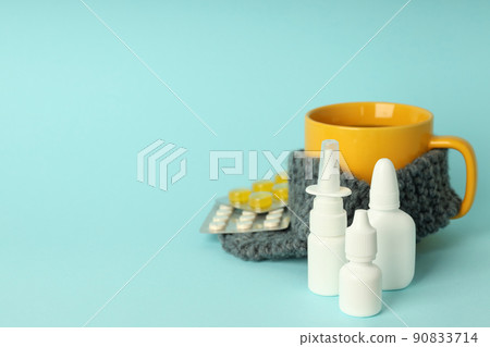 Flu treatment accessories on blue background, space for text Flu treatment accessories on blue background, space for text 90833714