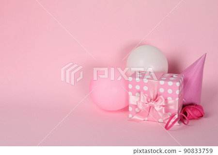 Birthday accessories on pink background, space for text 90833759