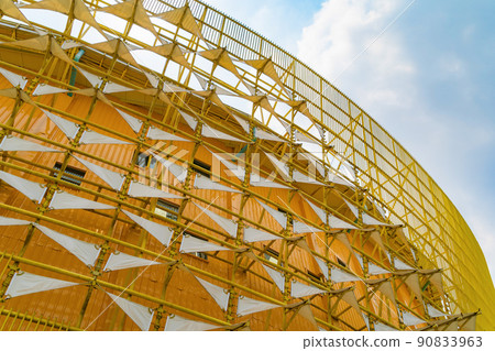 Steel structure roof of office building. Windows glass facade supported. Abstract architecture fragment background. Steel structure roof of office building. Windows glass facade supported. Abstract architecture fragment background. 90833963