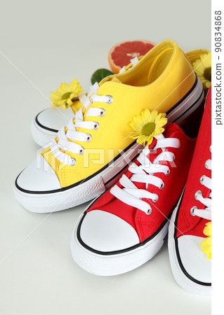Summer clothes concept with sneakers on white background Summer clothes concept with sneakers on white background 90834868