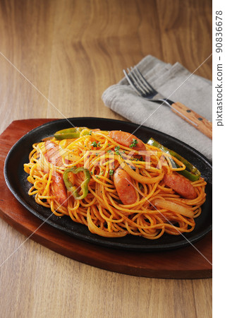 Napolitan spaghetti served on an iron plate 90836678