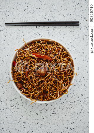 plate with chicken yakisoba noodles and chopsticks plate with chicken yakisoba noodles and chopsticks 90836710