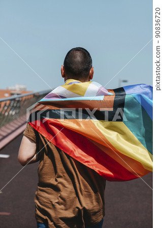 man wears an intersex-inclusive progress pride flag 90836720