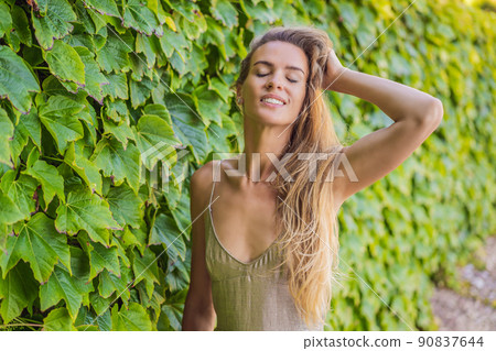 Woman tourist walking in Montenegro. Panoramic summer landscape of the beautiful green Royal park Milocer on the shore of the the Adriatic Sea, Montenegro Woman tourist walking in Montenegro. Panoramic summer landscape of the beautiful green Royal park Milocer on the shore of the the Adriatic Sea, Montenegro 90837644