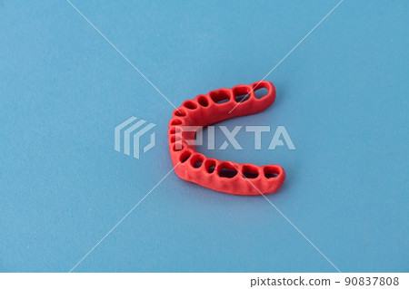 human gums without teeth model medical implant isolated on blue background. Healthy teeth, dental care and orthodontic concept. human gums without teeth model medical implant isolated on blue background. Healthy teeth, dental care and orthodontic concept. 90837808