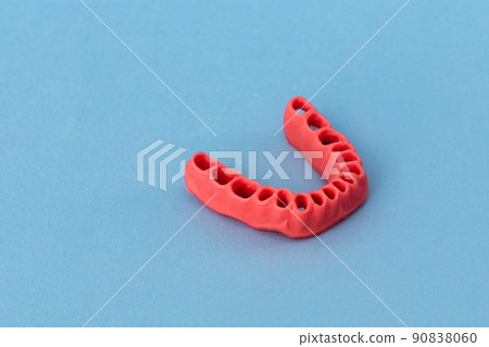 human gums without teeth model medical implant isolated on blue background. Healthy teeth, dental care and orthodontic concept. 90838060