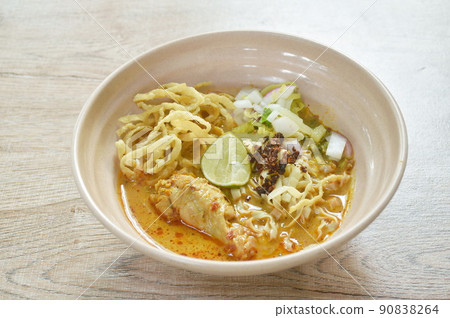 Thai northern style curry noodles in coconut milk soup with chicken on bowl 90838264