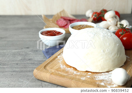 Concept of cooking pizza on gray wooden table Concept of cooking pizza on gray wooden table 90839452