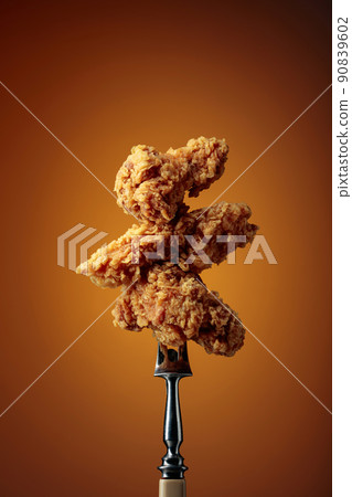 Fried chicken on a fork. Fried chicken on a fork. 90839602
