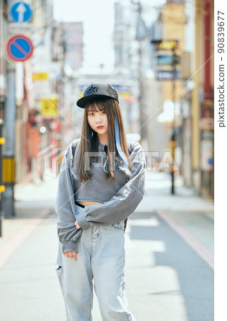 Gen Z women standing looking at the camera 90839677
