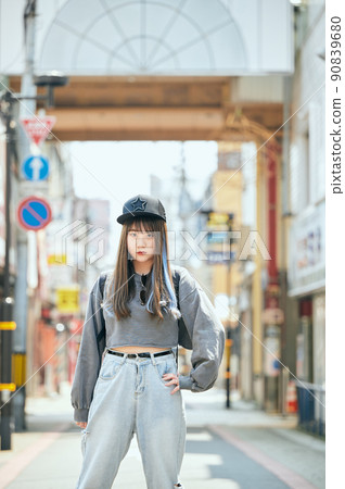 Gen Z women standing looking at the camera 90839680