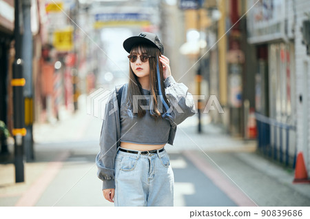 Gen Z women standing looking at the camera 90839686