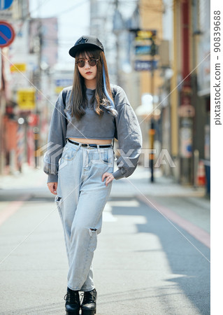 Gen Z women standing looking at the camera 90839688