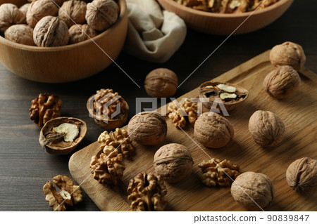 Concept of healthy food with walnuts on wooden background Concept of healthy food with walnuts on wooden background 90839847