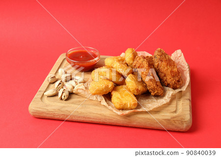 Concept of Super bowl snacks on red background Concept of Super bowl snacks on red background 90840039