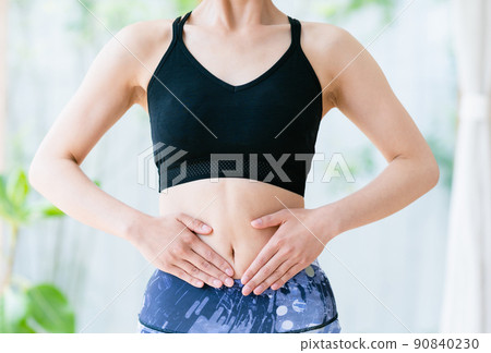 A woman (parts) to check the condition of her stomach A woman (parts) to check the condition of her stomach 90840230