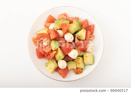 Tomato and avocado salad 90840517