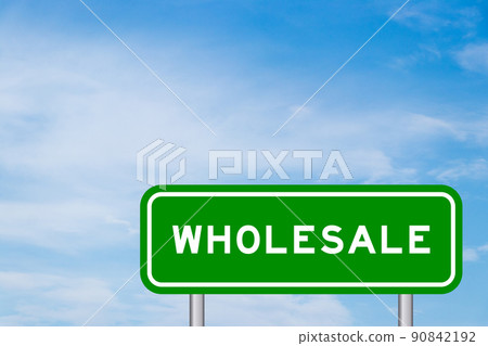 Green color transportation sign with word wholesale on blue sky with white cloud background 90842192