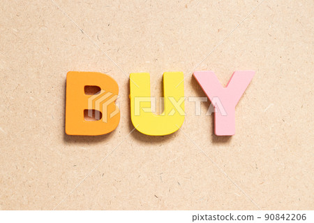 Color alphabet letter in word buy on wood background 90842206