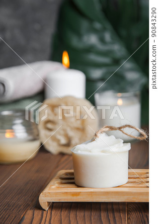 Natural soap, loofah scrubber on podium in bathroom. Zero waste in life. Relaxation spa concept, candles, beauty... Natural soap, loofah scrubber on podium in bathroom. Zero waste in life. Relaxation spa concept, candles, beauty... 90843290