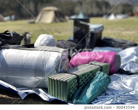 Camping equipment spread at the campsite 90843594