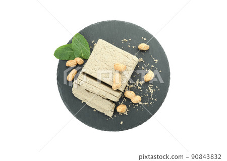 Round tray with halva and peanut isolated on white background Round tray with halva and peanut isolated on white background 90843832