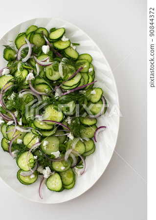 Salad of cucumbers, onions and feta cheese Salad of cucumbers, onions and feta cheese 90844372