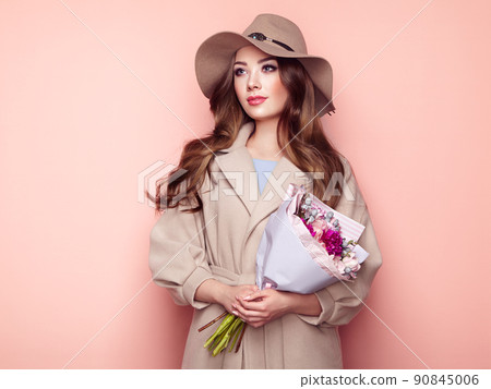 Brunette young woman in stylish greatcoat Brunette young woman in stylish greatcoat 90845006