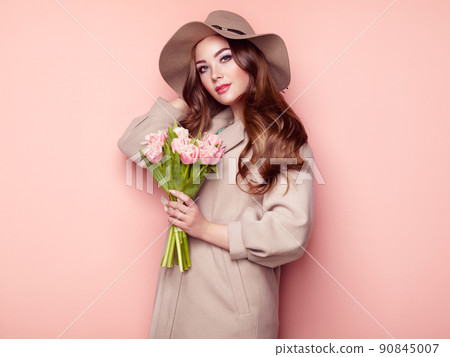 Brunette young woman in stylish greatcoat Brunette young woman in stylish greatcoat 90845007