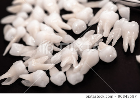 Teeth implant and crown installation process parts isolated on a blue background. Medically accurate 3D model.  90845587