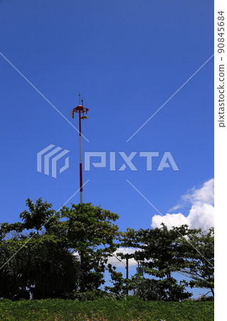Aviation Navigation and safety equipment pole at modern airport with blue sky. Aviation Navigation and safety equipment pole at modern airport with blue sky. 90845684