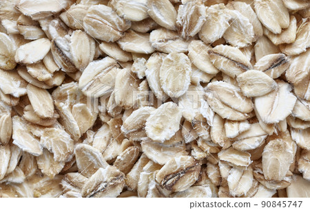 Close up picture of whole grain oats, selective focus, abstract food background. Close up picture of whole grain oats, selective focus, abstract food background. 90845747
