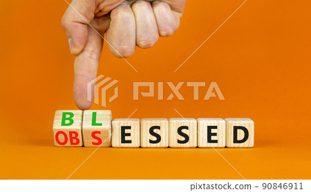 Blessed or obsessed symbol. Businessman turns wooden cubes and changes the concept word Obsessed to Blessed. Beautiful orange table orange background. Business blessed or obsessed concept. Copy space. Blessed or obsessed symbol. Businessman turns wooden cubes and changes the concept word Obsessed to Blessed. Beautiful orange table orange background. Business blessed or obsessed concept. Copy space. 90846911