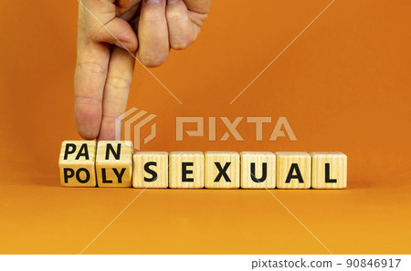 Pansexual or polysexual symbol. Doctor turns wooden cubes and changes the word 'polysexual' to 'pansexual'. Beautiful orange background, copy space. Social, pansexual or polysexual concept. Pansexual or polysexual symbol. Doctor turns wooden cubes and changes the word 'polysexual' to 'pansexual'. Beautiful orange background, copy space. Social, pansexual or polysexual concept. 90846917