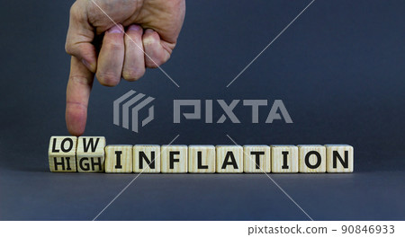 High or low inflation symbol. Businessman turns cubes and changes concept words High inflation to Low inflation. Beautiful grey background. Business and high or low inflation concept. Copy space. High or low inflation symbol. Businessman turns cubes and changes concept words High inflation to Low inflation. Beautiful grey background. Business and high or low inflation concept. Copy space. 90846933