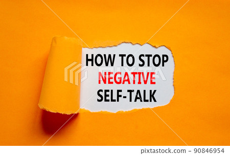Stop negative self-talk symbol. Concept words How to stop negative self-talk on white paper on a beautiful orange background. Psychological and stop negative self-talk concept. Copy space. 90846954