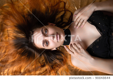 beauty portrait of a girl with red hair. 90848644