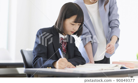 Female students taking classes at cram school Junior high school high school students 90849377