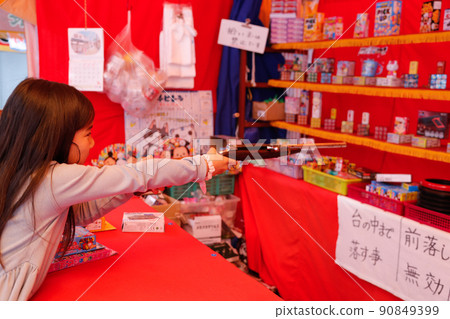 Girl enjoying shooting 90849399