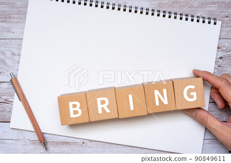 Blocks, notebooks, pens, hands labeled "BRING" 90849611