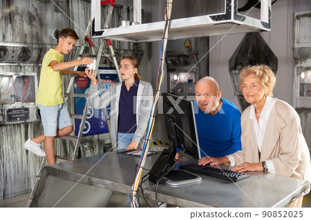 Grandparents and grandchildren resolveing riddles in escape room Grandparents and grandchildren resolveing riddles in escape room 90852025
