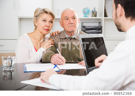 Old man and woman in social department 90852168