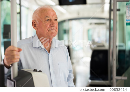 Old man in streetcar Old man in streetcar 90852414